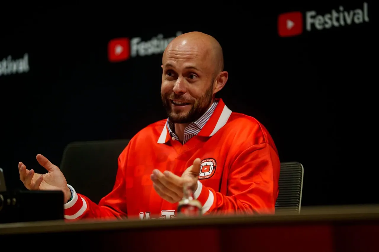 Mick Brands speaking on stage at YouTube Festival
